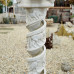Statue Loeries on white spiral marble pedestal